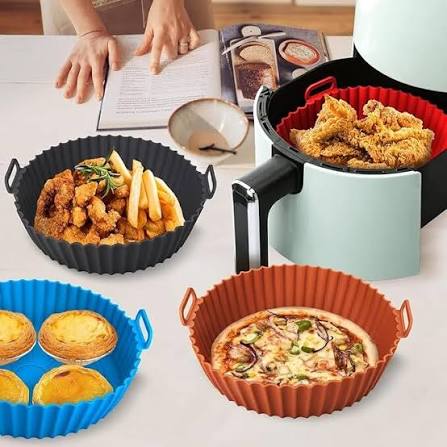 Silicone air fryer liners in multiple colors with food